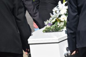 Grief as casket carried at funeral