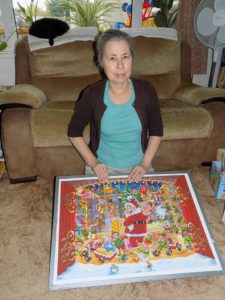 My mum with completed puzzle