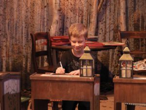 Child writing letter to Father Christmas