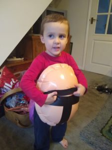 toddler wearing inflatable belly