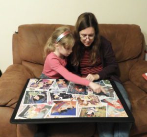 Mother and daughter working on puzzle