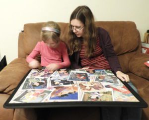 Mother and daughter working on puzzle