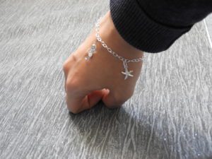 Bracelet being worn on lady's wrist