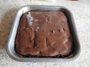 chocolate and cherry brownies iced before sliced